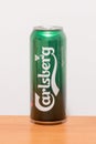 Can of Carlsberg alcohol beer on wooden table