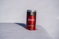 Can of Coca-Cola plus coffee on a bed of snow and white background Royalty Free Stock Photo