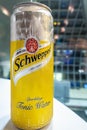 A can of cold Schweppes Sparkling Tonic Water on a table