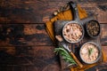 Can with Conserved tuna fillet meat. Wooden background. Top view. Copy space