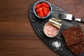 Can of conserved tuna, tomatoes and bread on wooden table, top view. Space for text