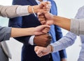 We can do anything we put our minds to. a group of unrecognizable businesspeople stacking their hands on top of each Royalty Free Stock Photo