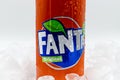 Can of Fanta soda on ice with water droplets. Royalty Free Stock Photo