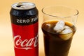 Can and glass of Coca Cola with ice and water droplets. Royalty Free Stock Photo