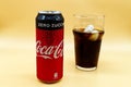 Can and glass of Coca Cola with ice and water droplets. Royalty Free Stock Photo