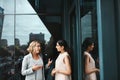 We can grow our dreams with dedication. two businesswomen having a discussion on the office balcony. Royalty Free Stock Photo