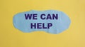We can help you. Text on blue piece of paper