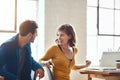 Can I ask you a favour. two young businesspeople working together in a modern office. Royalty Free Stock Photo