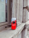 Can of Jupiler lager beer abandoned on a window sill outside