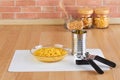 Can opener and bowl of canned corn