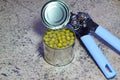 Can opener with a tin of peas. Royalty Free Stock Photo