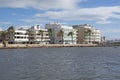 Seagulls in bay and BQ Aquamarina oceanfront hotel in strong winds