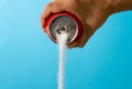 Can pouring sugar stream in calories content of soda energetic and refreshing drinks