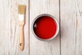 Can with red paint and brush on wooden background Royalty Free Stock Photo