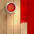 A can of red paint on a wooden background Royalty Free Stock Photo