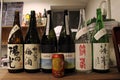 Can of Suntory beer among Japanese sake