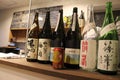 Can of Suntory beer among Japanese sake