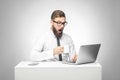 Can`t believe! Portrait of emotional shocked young businessman in white shirt and black tie are sitting in office, reading news Royalty Free Stock Photo