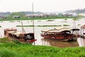 Boats on the green riverbanks of the Mekong river in the town of Can Tho in south Vietnam Royalty Free Stock Photo