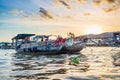 Can Tho, Vietnam - january 7, 2020: Cai Rang floating market at sunrise, boats selling wholesale fruits and goods on Can Tho River