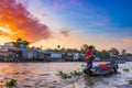 Can Tho, Vietnam - january 7, 2020: Cai Rang floating market at sunrise, boats selling wholesale fruits and goods on Can Tho River