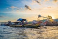 Can Tho, Vietnam - january 7, 2020: Cai Rang floating market at sunrise, boats selling wholesale fruits and goods on Can Tho River