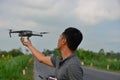 A young man holding the Mavic 2 Pro