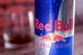 A can, tin of fresh red bull energy drink with brick wall backround. Red bull company is the most popular energy brand in the wor