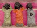 Silent Trio: Puppets in Clothing Storage Royalty Free Stock Photo