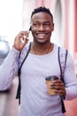 Can you hear me now. a young man using his phone while out in the city. Royalty Free Stock Photo