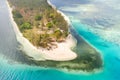 Canabungan Island with sandy beach. Tropical island with white beach on the large atoll, aerial view