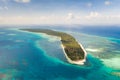 Canabungan Island with sandy beach. Tropical island with white beach on the large atoll, aerial view