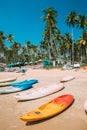 Canacona, Goa, India. Canoe Kayak For Rent Parked On Famous Palolem Beach On Background Tall Palm Tree In Summer Sunny