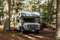 Canada Algonquin National Park 30.09.2017 Woman in front of Parked RV camper Lake two rivers Campground Cruise America Royalty Free Stock Photo