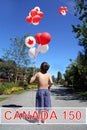 Canada day 150. Boy with Birthday balloons. Royalty Free Stock Photo