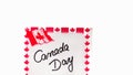 Canada day handwriting on paper with Canada flag. Writing text on memo post reminder. Bucharest, Romania, 2020 Royalty Free Stock Photo