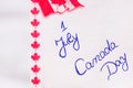 Canada day 1 July handwriting on paper with Canada flag. Writing text on memo post reminder Royalty Free Stock Photo