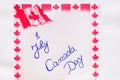 Canada day 1 July handwriting on paper with Canada flag. Writing text on memo post reminder Royalty Free Stock Photo