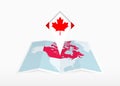 Canada is depicted on a folded paper map and pinned location marker with flag of Canada Royalty Free Stock Photo