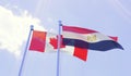 Canada and Egypt, flags waving against blue sky