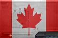 Canada flag depicted on side part of military armored truck closeup. Army forces conceptual background Royalty Free Stock Photo