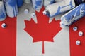 Canada flag and few used aerosol spray cans for graffiti painting. Street art culture concept