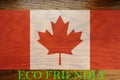 Canada flag on wooden background for global eco friendly environment, ecological and environmental saving and go green country