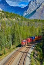 CANADA. Freight train passing picturesque Yolo national park Royalty Free Stock Photo