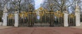 Ornate wrought iron and gold Canada Gate of the Green Park in front of the Buckingham Palace in London UK