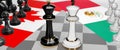 Canada and Mexico - talks, debate, dialog or a confrontation between those two countries shown as two chess kings with flags that Royalty Free Stock Photo