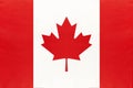 Canada national fabric flag, textile background. Symbol of international world north America country