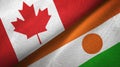 Canada and Niger two flags textile cloth, fabric texture