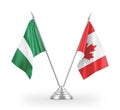 Canada and Nigeria table flags isolated on white 3D rendering