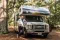 Canada Algonquin National Park 30.09.2017 man in front of Parked RV camper Lake two rivers Campground Cruise America Royalty Free Stock Photo